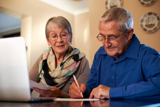istock Senior Couple At Home Checking Personal Finances On Laptop 1277120490
