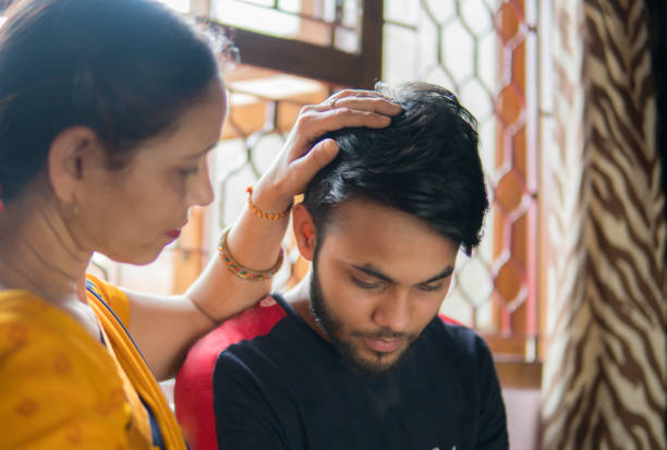 istock Mother consoling her young adult son. 1277121187