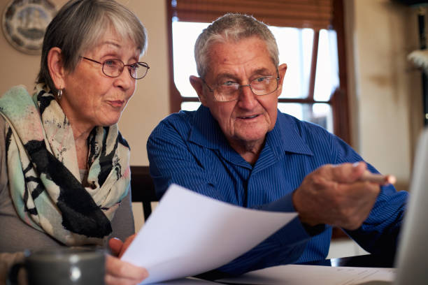 istock Senior Couple At Home Checking Personal Finances On Laptop 1277121243