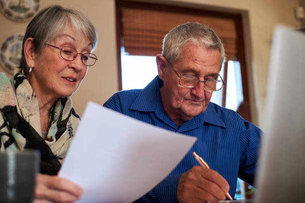 istock Senior Couple At Home Checking Personal Finances On Laptop 1277121269