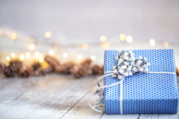 istock New year holiday background with a blue gift box. 1277125316