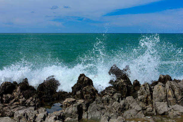 istock Sea waves crash and splash on rocks. 1277125501