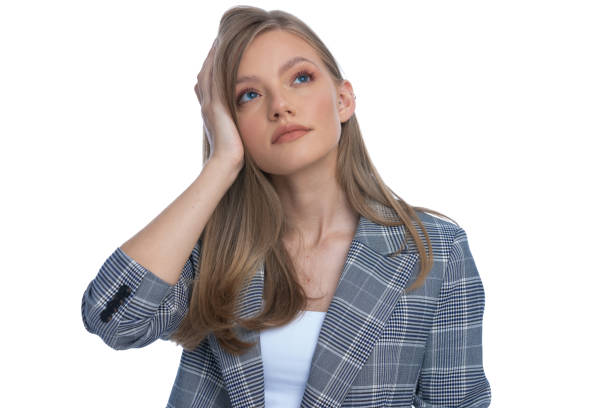 istock young girl in blue checkered suit looking up and dreaming 1277130852