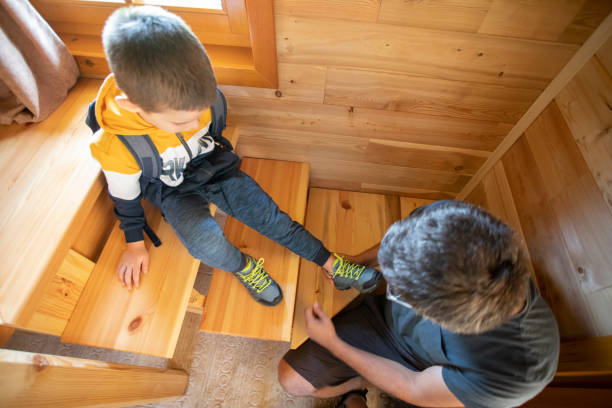 istock Father tying his sons shoelaces 1277132059