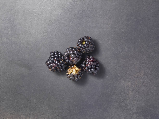 istock Fresh ripe blackberries on a black background. 1277132263
