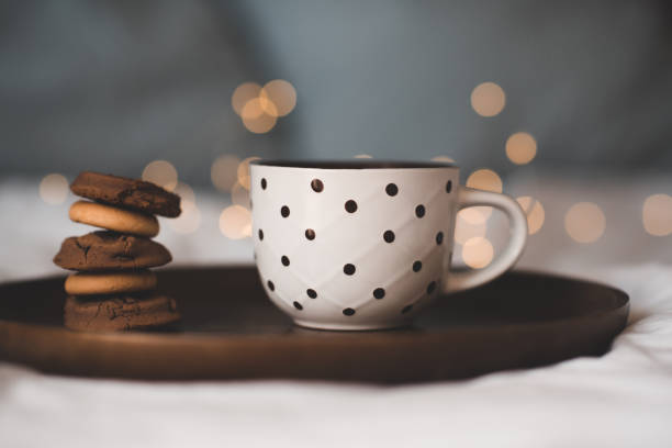 istock Cup of coffee over lights 1277132565
