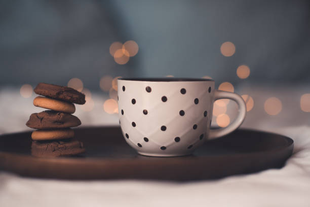 istock Cup of coffee over lights 1277132611
