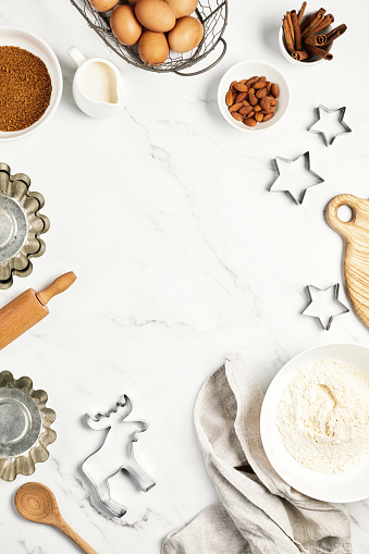 Christmas baking background with baking ingredients, top down view, blank space for a text