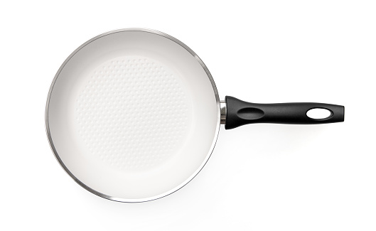 White empty (new) cooking pan on a white background from above, clipping path is also included