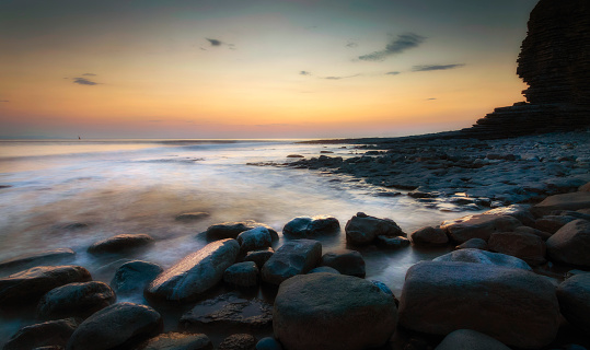 Sunset over the rocks at Nash Point on the Heritage coast in Glamorgan, South Wales, UK