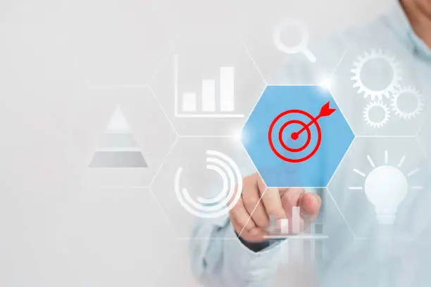 Photo of Achievement business target concept , Businessman touching to virtual monitor board which print screen red target dart.