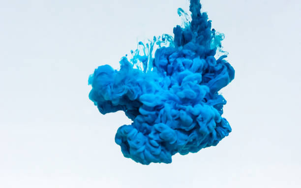 istock Squeezing the blue paint into the water. 1277136284