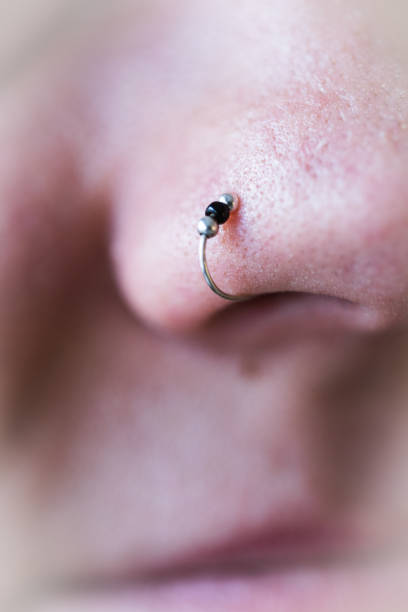istock Nose ring attached to the nose. 1277136389