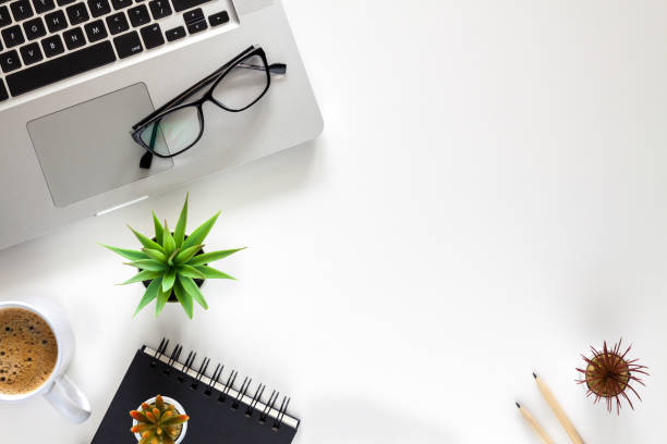 istock Office desk with a laptop. Coffee and office supplies. 1277136488