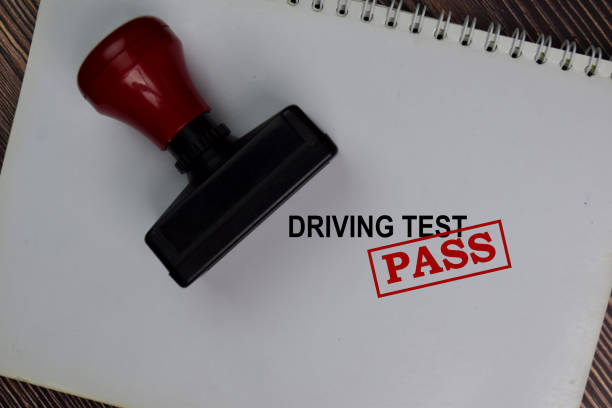 istock Red Handle Rubber Stamper and Driving Test Pass text isolated on the table. 1277138167