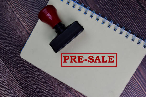 istock Red Handle Rubber Stamper and Pre-Sale text isolated on the table. 1277138233