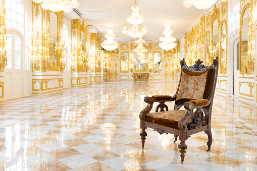 interior view of vintage wooden chair in luxury mirror room or hall decorated with chandelier
