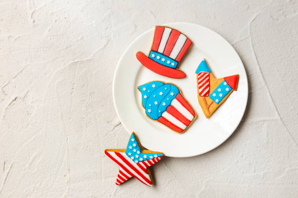 American flag cookies. Holiday sugar cookies on a flag. Patriotic cookies for 4th of July American flag cookies. Holiday sugar cookies on a flag. Patriotic cookies for 4th of July white sugar cookie stock pictures, royalty-free photos & images