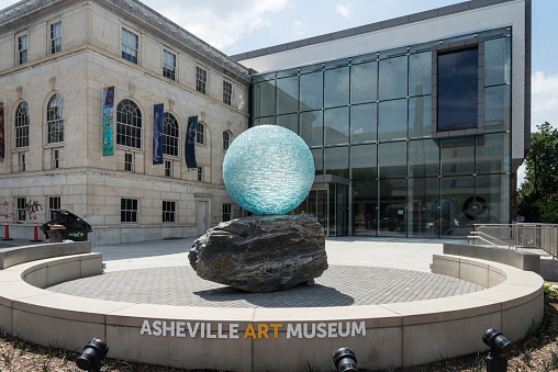 Asheville, NC, USA.  June 5, 2020.  Downtown Asheville in front of the Asheville Art Museum showing a piece of sculpture outdoors in Asheville.