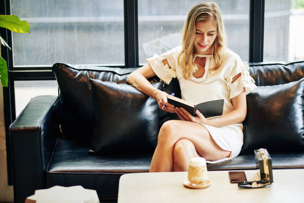 istock Elegant woman reading book 1277140044