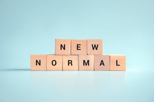istock Wooden cubes with NEW NORMAL word. 1277140084