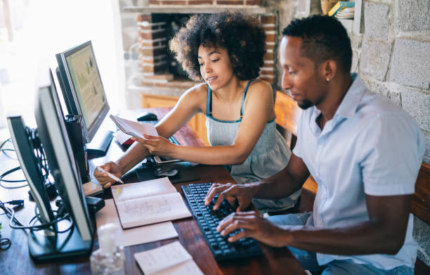 istock Afro couple working from home, during time in isolation, during COVID-19 1277141408