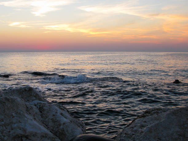 istock dawn on the seashore with stones and pebbles 1277141472