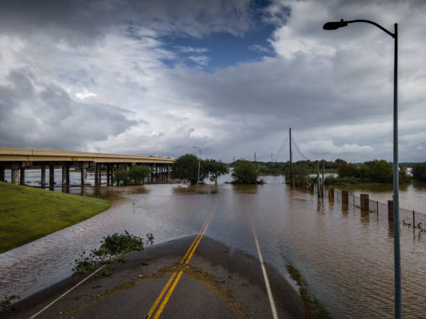 Storm surge covering flooded road stock photo