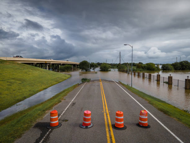 istock Road cones blocking flooded street 1277142277