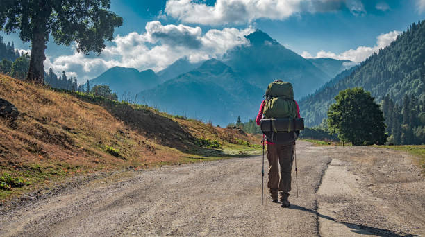 istock Tourist on road at mountains background 1277142328