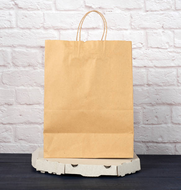 istock white cardboard box with pizza and disposable paper bag 1277142385