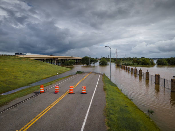 istock Road cones blocking flooded street 1277142957