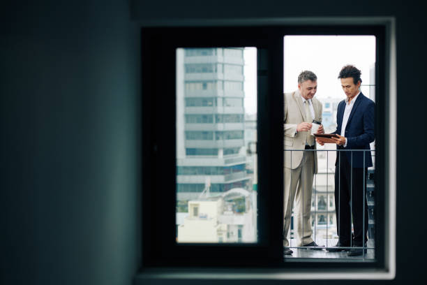 istock Business people discussing report 1277144133