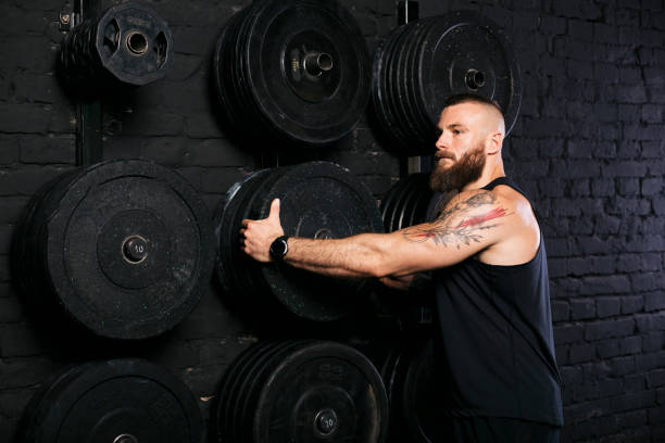 istock Big muscular Caucasian man in the gym 1277144848