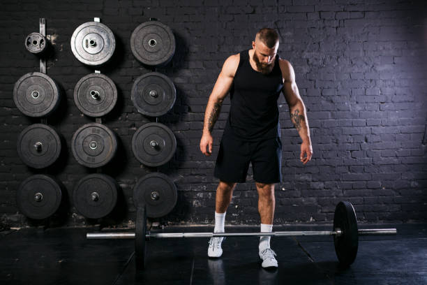 istock Muscular Caucasian bodybuilder training at the gym 1277145062