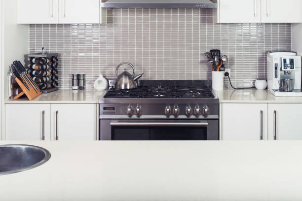 istock Modern kitchen interior with the stove and utensils with island table. 1277145161