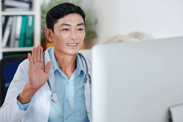 istock Greeting coworkers at online conference 1277147115