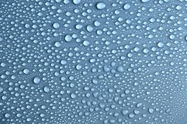 istock Water drops on light background, top view, close-up, macro. Great background with natural water drops and natural light 1277149483