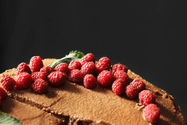 istock Prague cake. Chocolate cake with raspberries. Cake on a dark background. 1277149902