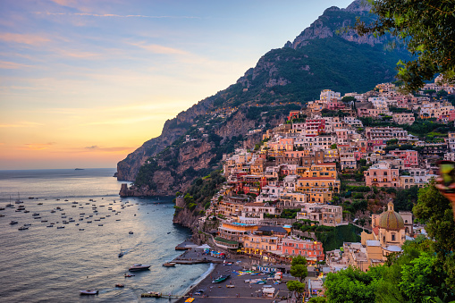Positano town at sunset - Italy famous destination in Amalfi Coast. Campania region. Scenic view of Positano city during golden hour.