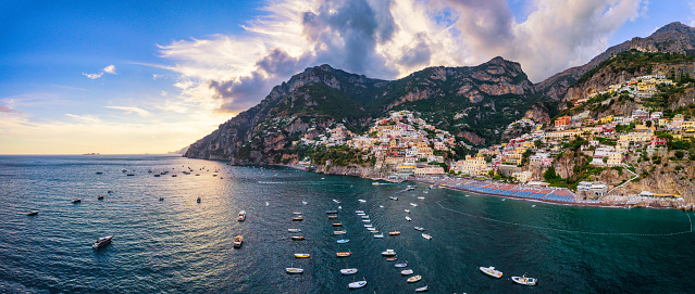 Aerial view of Positano at sunset, Italy. View from above the sea. Sunset behind the mountain.