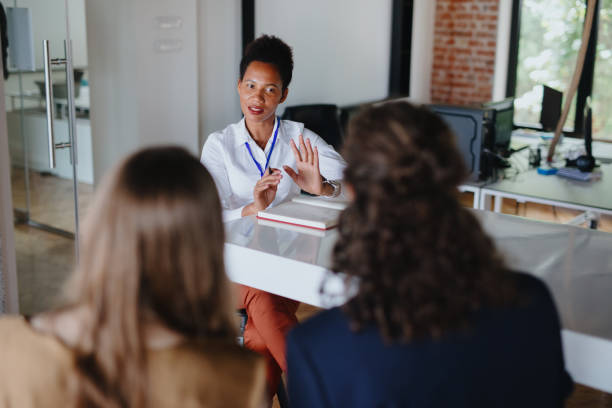 istock Female therapist listens to her clients sharing their problems. 1277153031