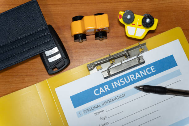 istock toy car, key, pen, document, car insurance concept on table 1277153106