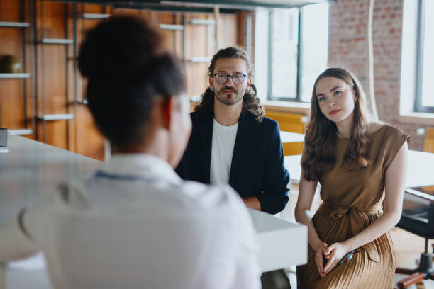 istock A female therapist gives advice to clients during a therapy session 1277153124
