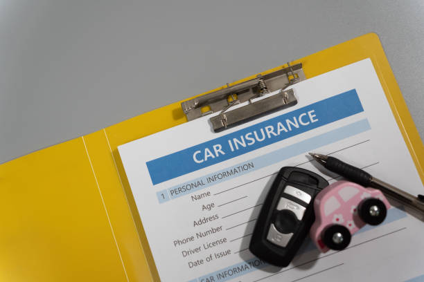 istock toy car, key, pen, document, car insurance concept on table 1277153139