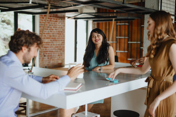 istock Cheerful multi-ethnic business team brainstorming in the office 1277153145