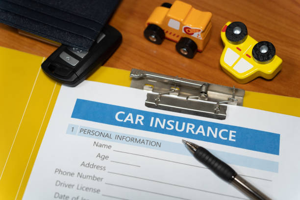 istock toy car, key, pen, document, car insurance concept on table 1277153147