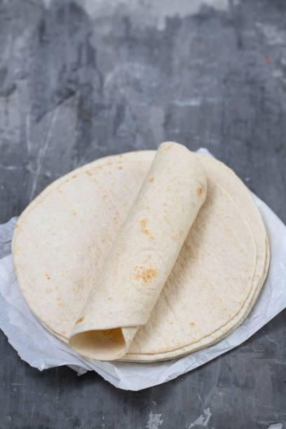 istock tortilla on white paper on ceramic background 1277153750
