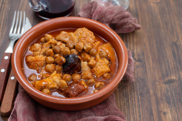 spanish dish callos, beef tripe stew with chickpeas, morcilla and chorizo in ceramic bowl
