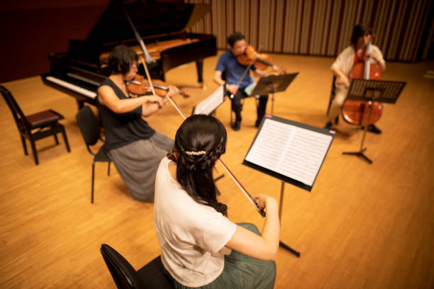istock Musician playing violin, viola and cello at classical concert 1277159362